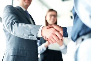 lawyer shaking hands with customer